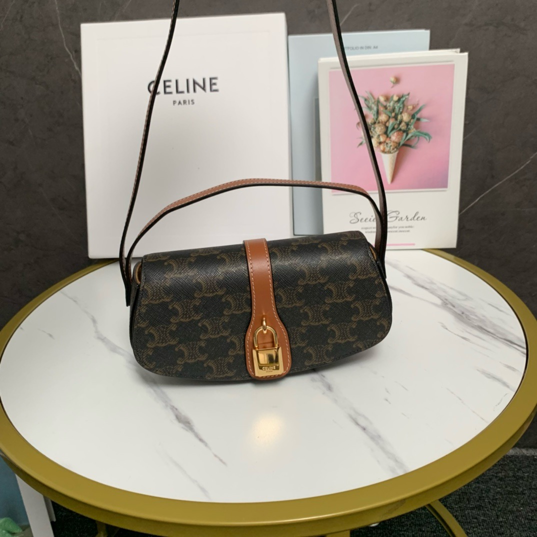 CELINE CLUTCH ON STRAP TABOU IN TRIOMPHE CANVAS AND CALFSKIN 101592 TAN